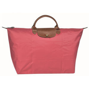 Sac de voyage rose le pliage Longchamp